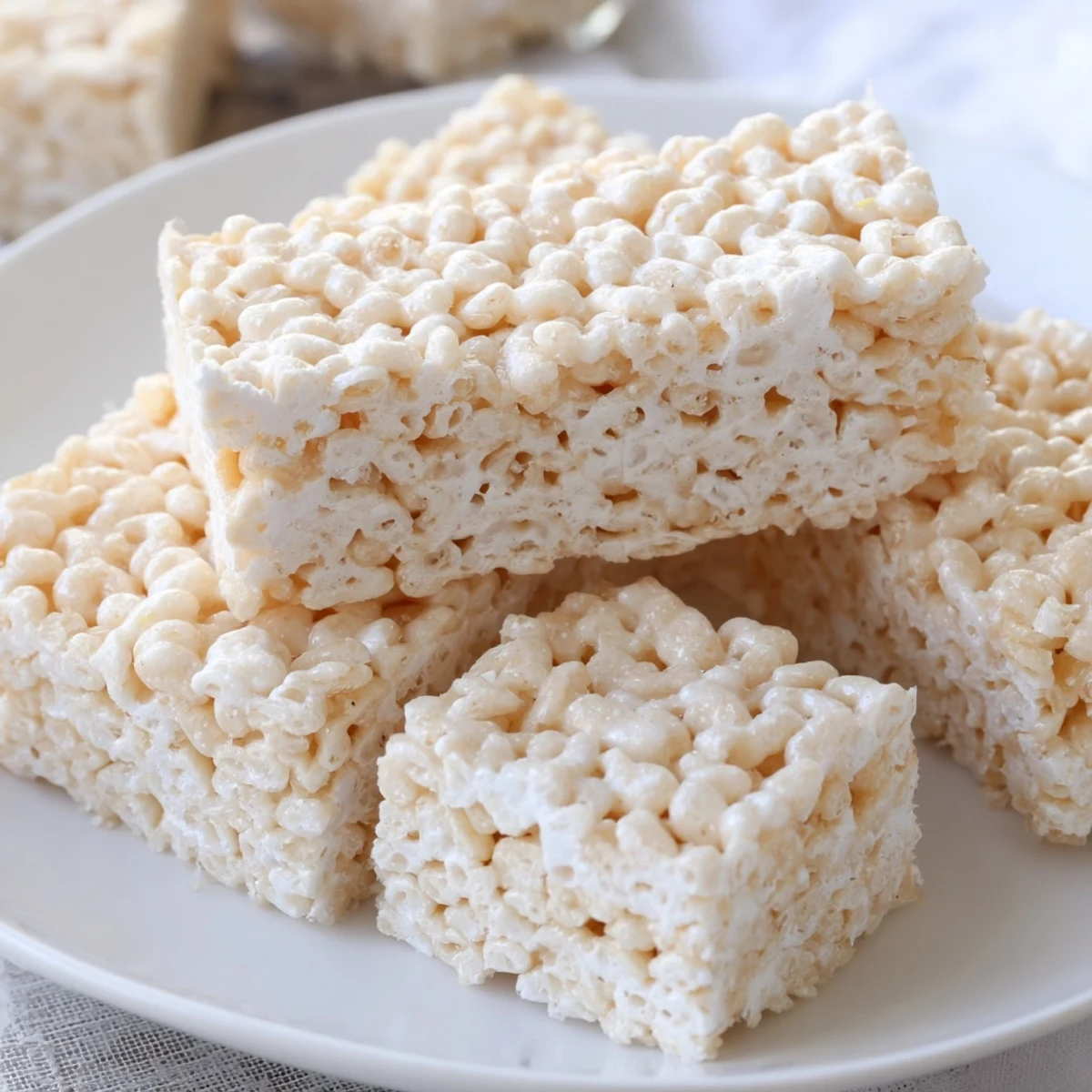 Gooey Classic Rice Krispie Treats cut into perfect, chewy bars, ready to enjoy.  