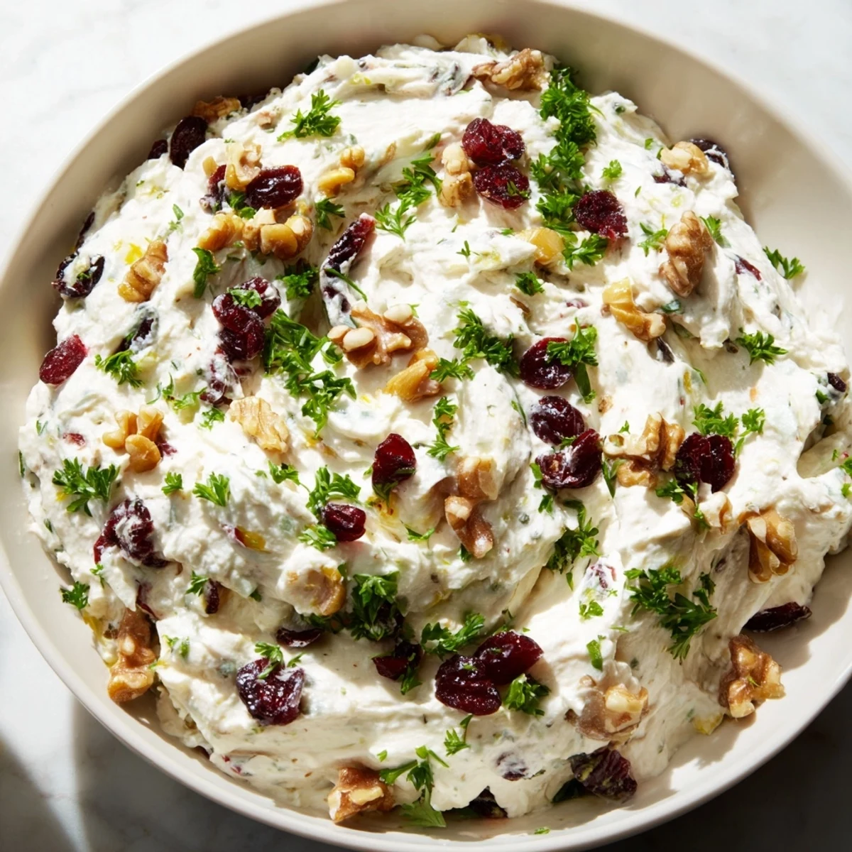 Whole grain crackers surround the lightened holiday cream cheese dip, ready for savory snacking and enjoyment.