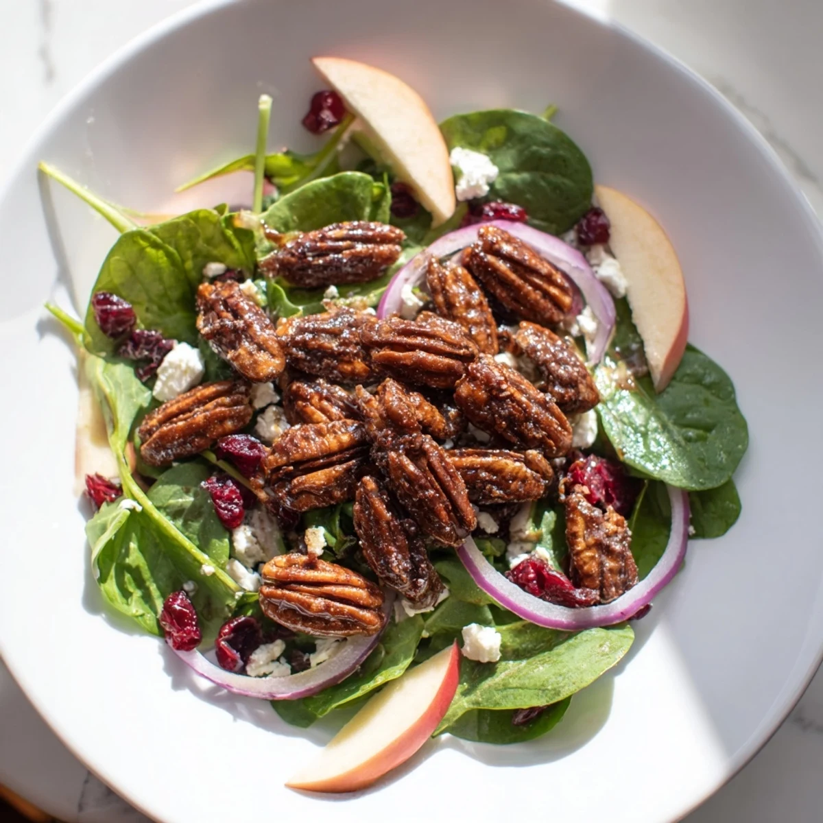 Fresh gingerbread spiced candied pecan salad, a vibrant mix of textures and flavors ready to eat.