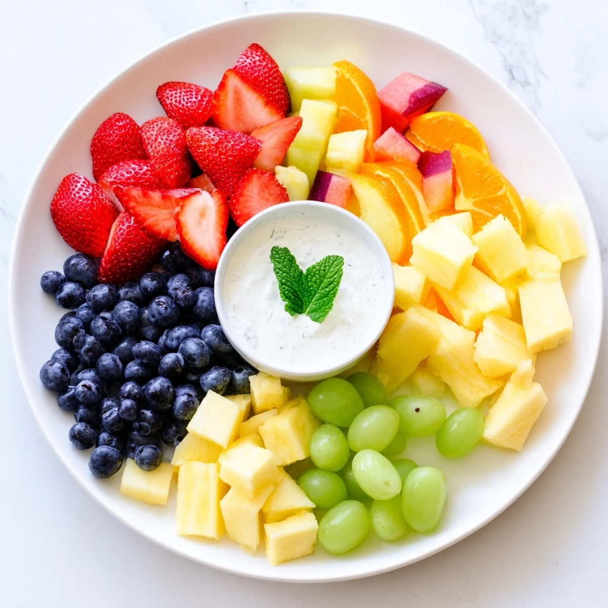 Delectable Beach Ball Fruit Platter: visually stunning arrangement of fresh, juicy fruits for a picnic.
