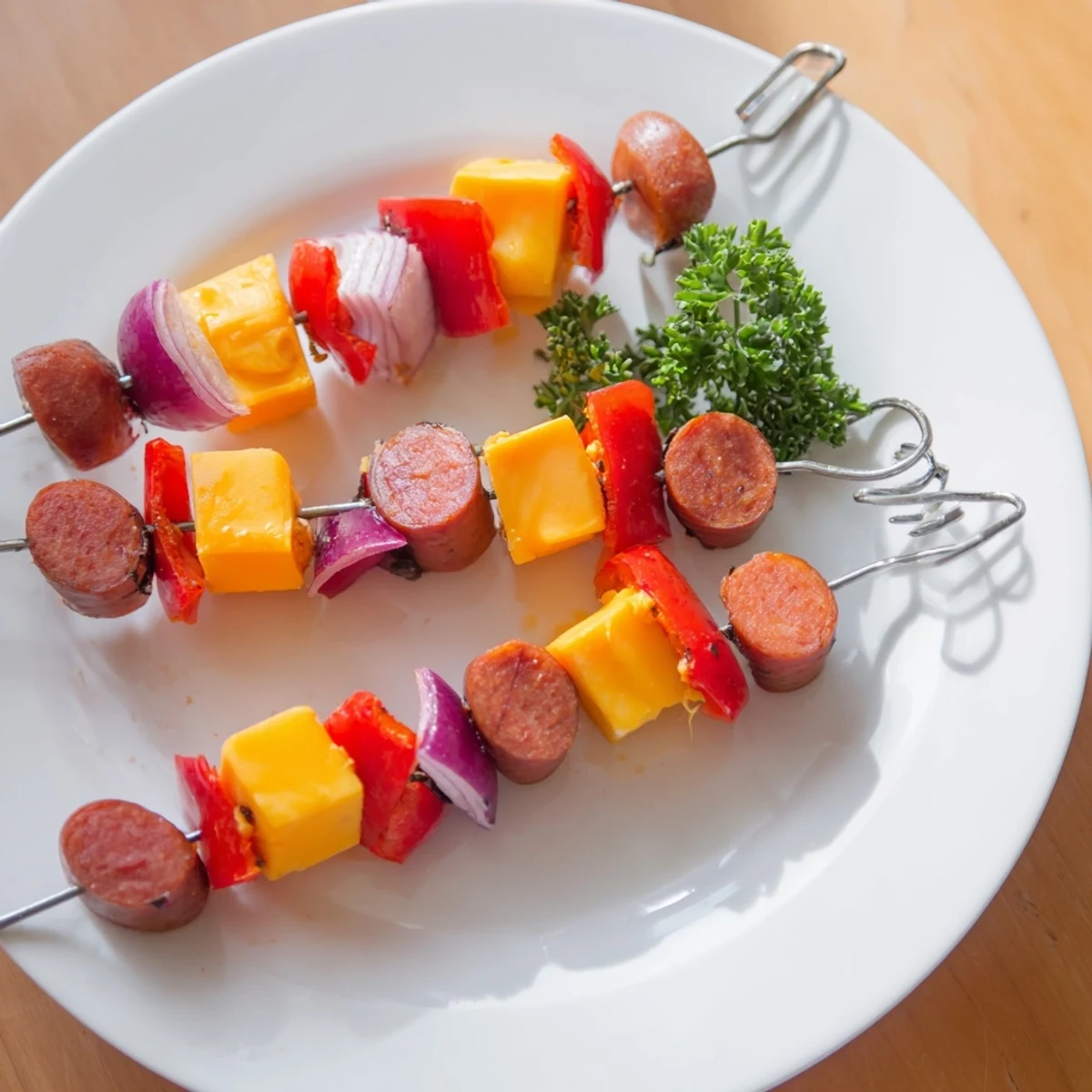 Savory Skewers: Chimney Stack Sausage and Cheese, grilled with cheese oozing and vegetables charred.