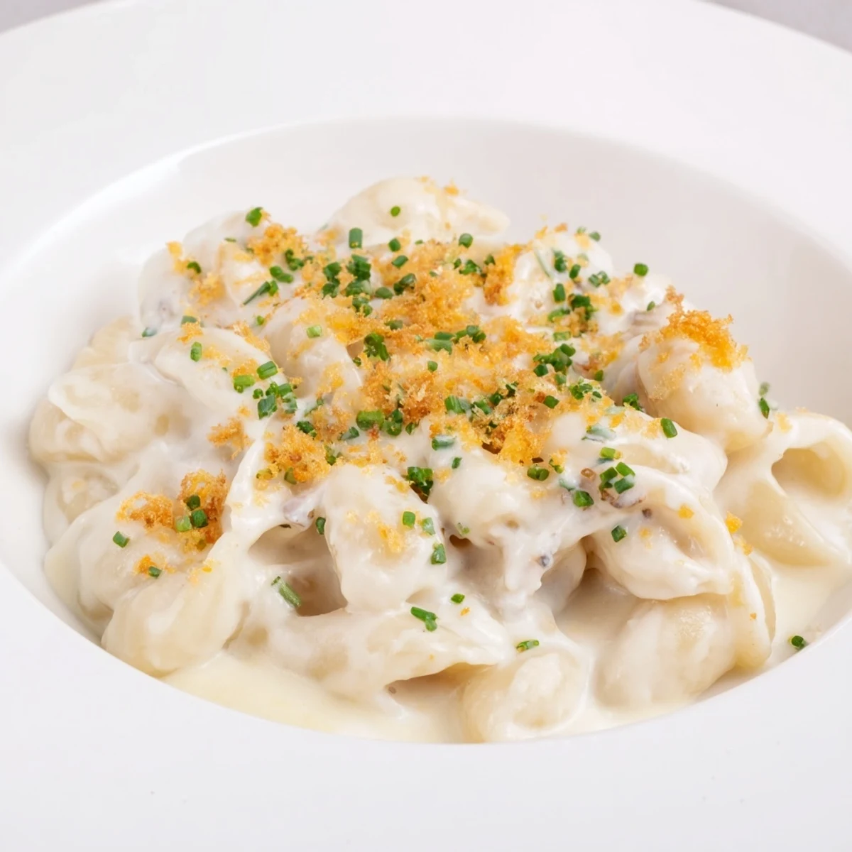 A comforting closeup showing creamy Cottage Cheese Mac and Cheese with a sprinkle of fresh herbs.