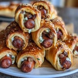 Mini Baseball Hot Dogs in Crescent Roll Dough: golden, bite-sized hot dogs wrapped in flaky crescent dough, perfect for game day snacks.