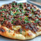 Rustic Turkish Lahmacun Pizza, vibrant with fresh toppings and a zesty crust.