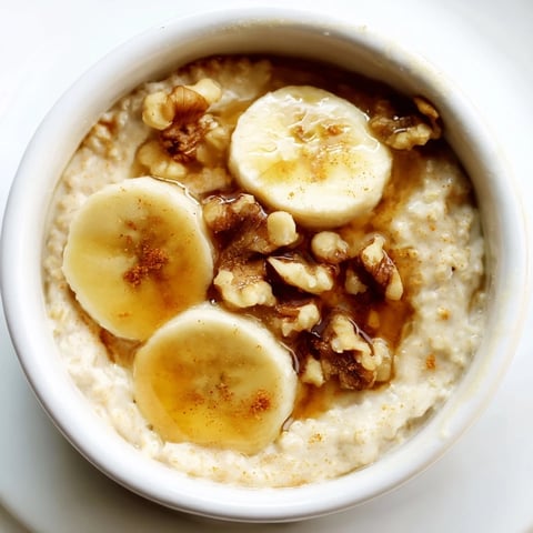 Golden baked oats ramekins with banana and honey, ready to serve with a sweet honey drizzle.