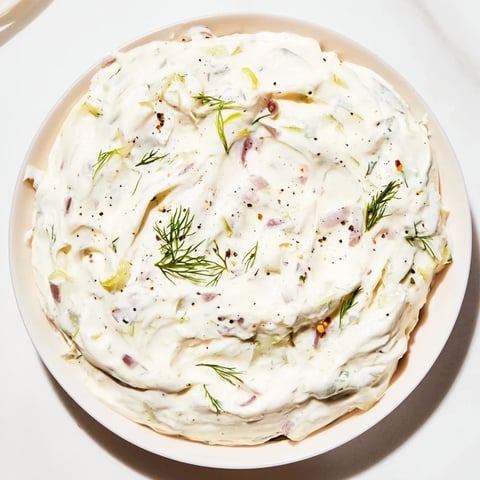 Creamy Sweet and Sour Pickle Relish Dip served with crispy tortilla chips, a perfect appetizer.