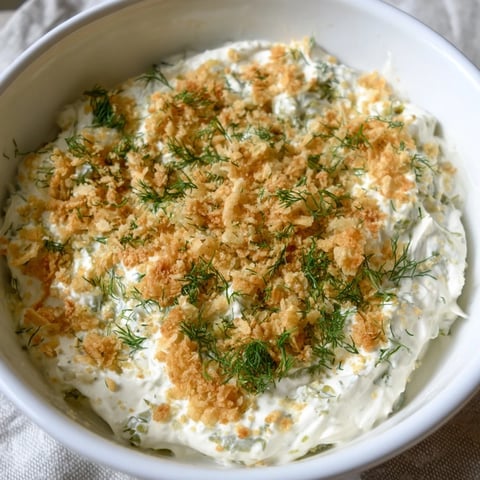 Creamy Fried Pickle Dip, ready to serve with crispy chips, a perfect game-day appetizer.