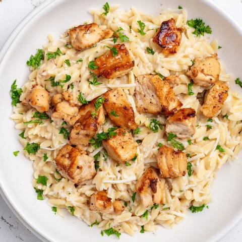 Creamy One-Pot Cajun Chicken Alfredo Orzo, with tender chicken and al dente pasta, a flavorful weeknight meal.