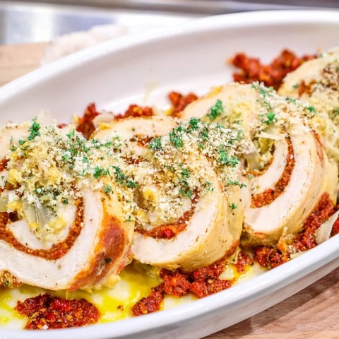 Golden-brown Marry Me Chicken and Stuffing Roulades, tender chicken with creamy tomato sauce.
