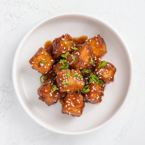 Golden air fryer turkey bites, glazed with honey, offer sweet and savory flavors for appetizers.
