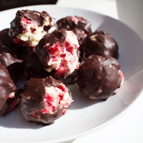 Strawberry Yogurt Clusters dipped in rich, dark chocolate are a perfect frozen treat.