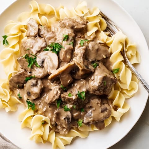 Rich and creamy Classic Beef Stroganoff with tender beef and sautéed mushrooms.  