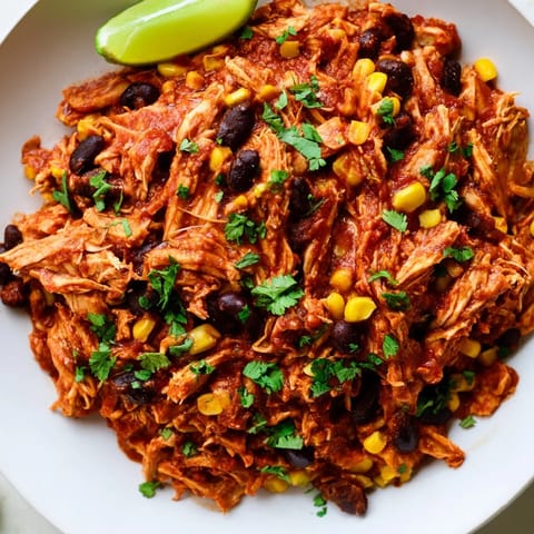 Juicy and flavorful Slow Cooker Salsa Chicken, ready to shred for tacos or burrito bowls.