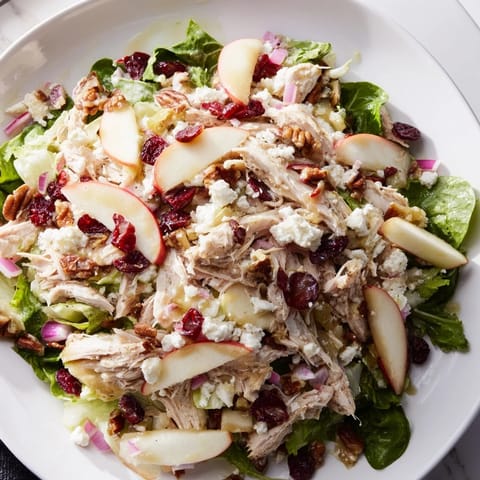 Delicious Chicken and Apple Winter Salad, ready to eat with crunchy pecans and a tangy dressing.