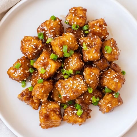 Crispy edges and tender inside describe the delicious air fryer chicken bites, ready to be enjoyed.