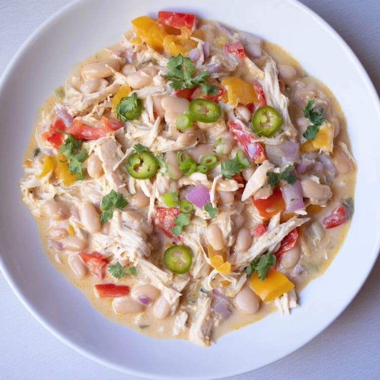 Delicious Creamy White Chicken Chili with beans, perfect for a cozy, comforting weeknight meal.
