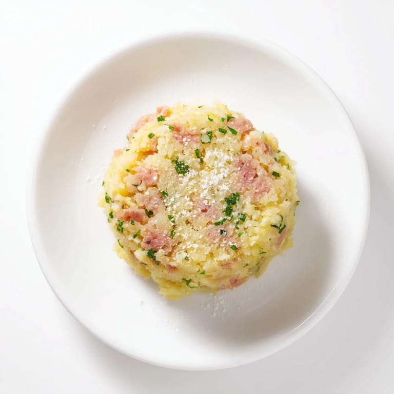 Enjoy the delicious crunch of these freshly fried Depression-Era Ham & Potato Patties served hot with a side.