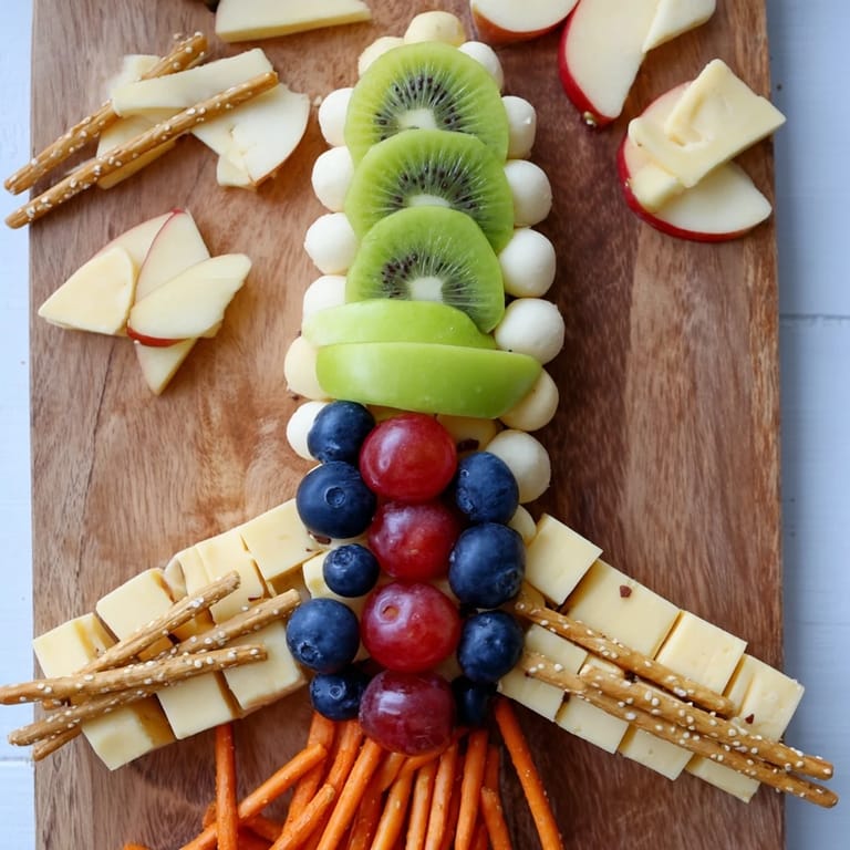 This visually exciting Spaceship Launch Snack Board offers fresh fruits, cheeses, and crunchy snacks for everyone.