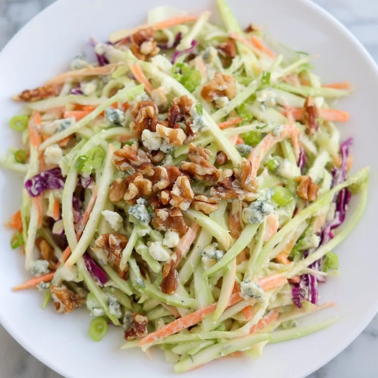Enjoy this refreshing and flavorful Crunchy Apple & Walnut Slaw, ideal for a light lunch.