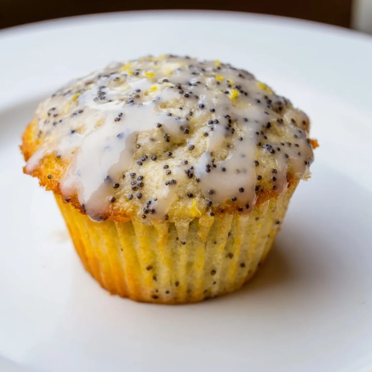 Freshly baked American Lemon Poppy Seed Muffins, arranged on a cooling rack, perfect for breakfast or a treat.