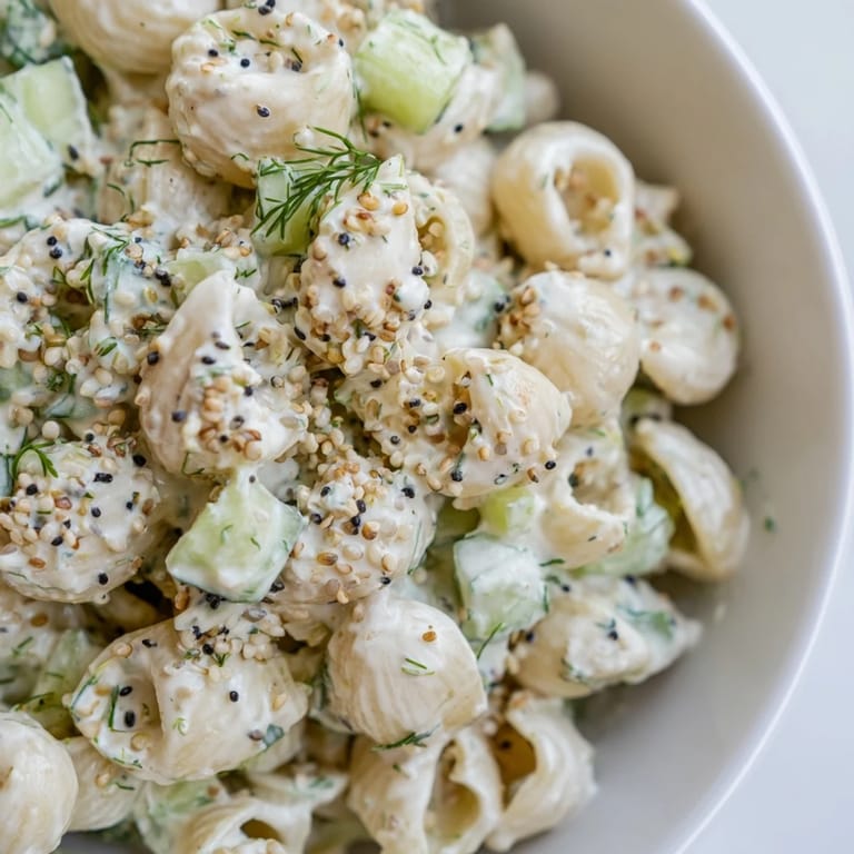 Small pasta shells mixed with diced cucumber, green onions, and a tangy sour cream and mayo dressing.
